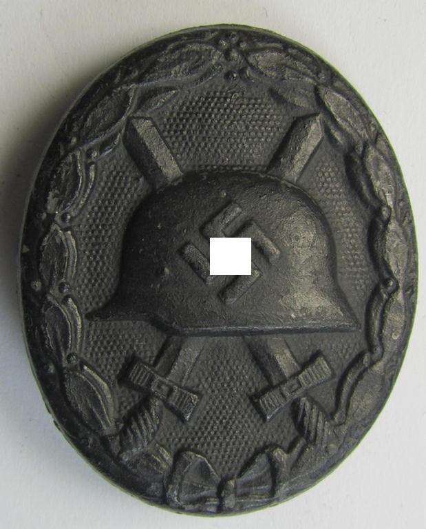 Attractive - albeit non-maker-marked - example of a black-class wound-badge (or: 'Verwundeten-Abzeichen in Schwarz') being of the: 'Übergrosse Wiedmann'-variant that comes in an overall nice- (ie. I deem just moderately used- and/or worn-), condition