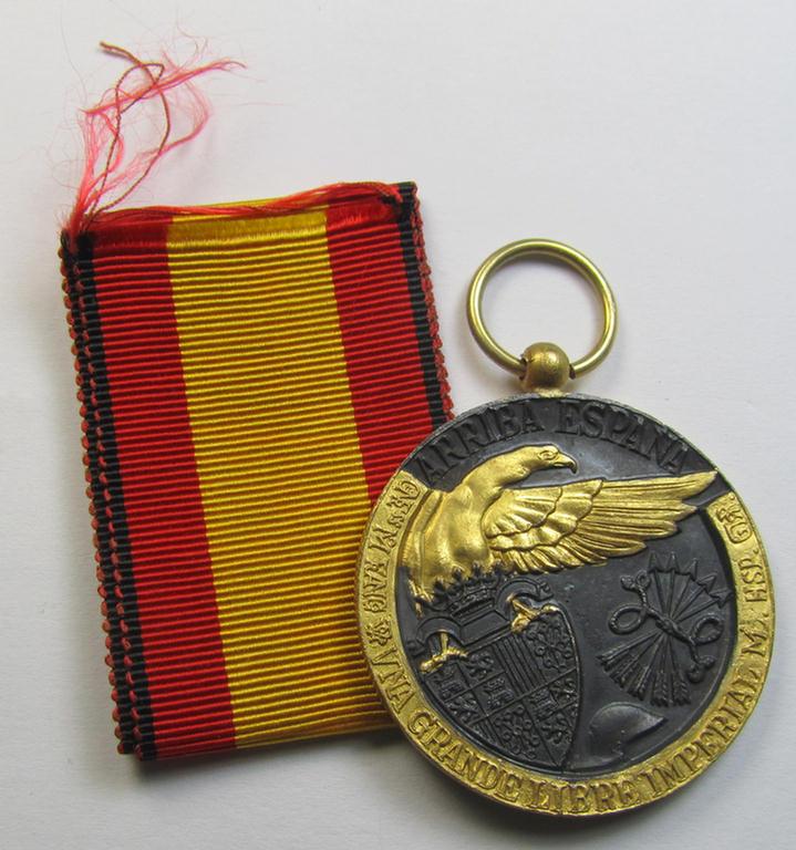 Spanish-issued Civil-War commemorative-medal called: 'Medalla de la Campaña 1936-1939' that comes together with its original (and never confectioned- ie. 'virtually mint') ribbon as issued