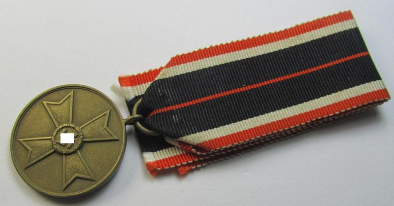 Attractive 'Kriegsverdienstmedaille 1939' being a non-maker-marked- (and/or: 'Buntmetall'-based) specimen that came mounted onto its (orange-red-coloured- and truly long-sized!) ribbon (ie. 'Bandabschnitt')