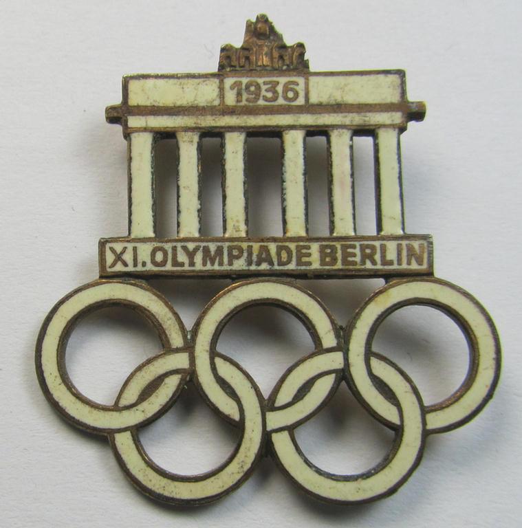 Commemorative - and neatly enamelled! - 'Veranstaltungsabzeichen' being a maker- (ie. 'Paulmann & Crone'-) marked example that is showing the Olympic rings above an illustration of the: 'Reichstag' coupled with text: 'XI. Olympiade Berlin 1936'