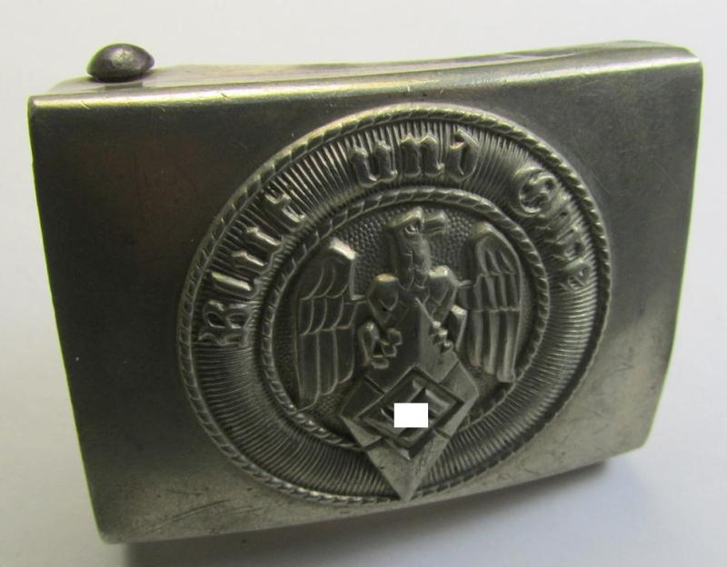 Attractive, HJ (ie. 'Hitlerjugend') silver-coloured- (ie. typical 'nickle-chrome'-based) belt-buckle being a clearly maker- (ie. 'A' and: 'Rzm M/17'-) marked example that comes in an overall very nice- and/or fully untouched, condition