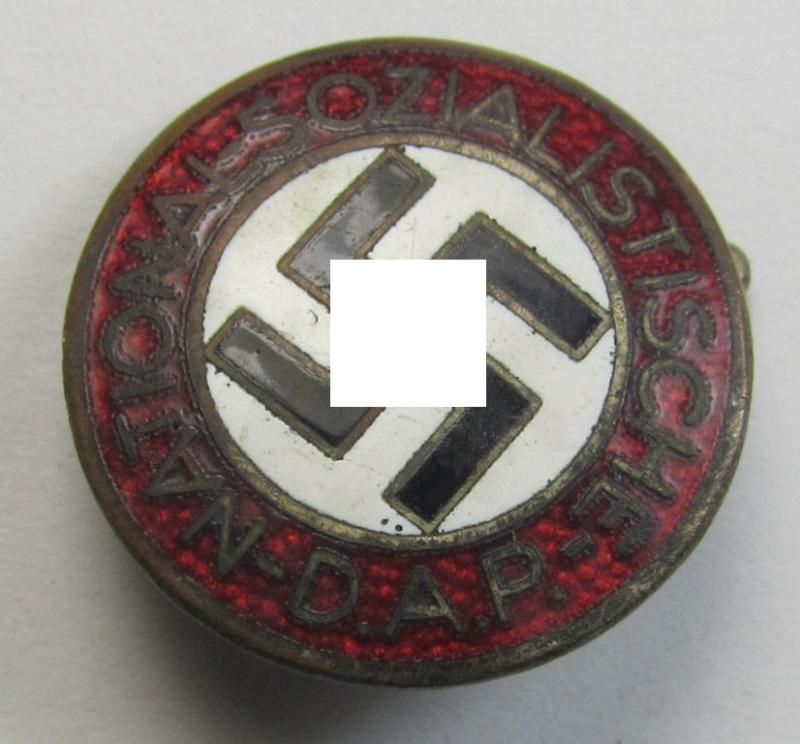 Attractive - darker-red-coloured! - 'N.S.D.A.P.'-membership-pin- ie. party-badge (or: 'Parteiabzeichen') which is maker-marked on the back with the (scarcely seen!) makers'-designation: 'RzM' and/or: 'M1/23'