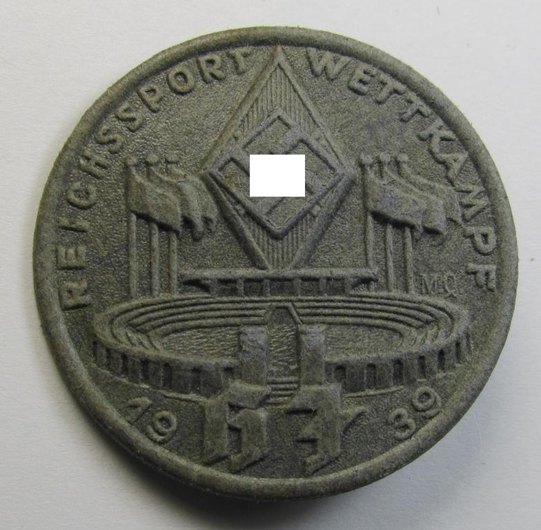 Commemorative - bluish-grey-coloured and/or: carton-based(!) - 'HJ'- (ie. Hitlerjugend-) related 'tinnie' depicting a sports-complex and 'HJ-Raute' and showing the text: 'Reichssport Wettkampf HJ - 1939'