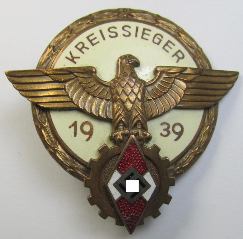 Attractive, 'HJ'- ('Hitlerjugend') ie. 'BDM'- ('Bund Deutscher Mädel') related: 'Reichsberufswettkampf-Siegerabzeichen' (of the 2nd model) entitled: 'Kreissieger 1939' and being a maker- (ie.: 'A.G. Tham'-) marked example