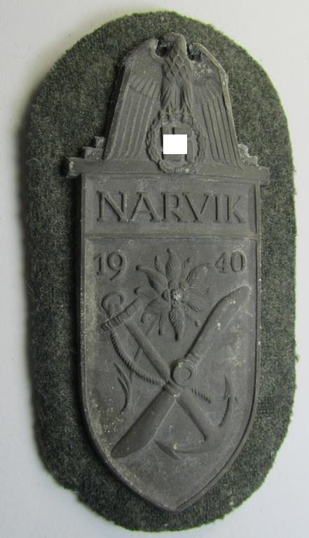 Superb - and scarcely encountered! - WH (Heeres) 'Narvik'-campaign-shield being a detailed example as executed in (tarnished) silver-toned zinc- (ie. 'Feinzink') and that comes in an issued- (albeit I deem never worn- nor tunic-attached-), condition