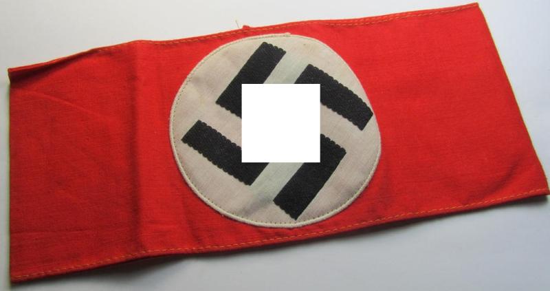 Superb - and simply never used! - so-called: N.S.D.A.P.-related party-armband (ie. 'Armbinde') being of the 'partly woven'-pattern showing an interwoven ie. 'machine-embroidered' swastika (ie. roundel)
