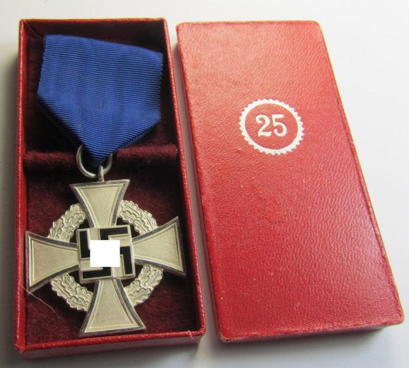 Attractive, 'Treuedienst Ehrenzeichen 2. Klasse' being a non-maker-marked example that came mounted onto its original ribbon (ie. 'Bandabschnitt') and that comes stored in its non maker-marked etui (ie. two-pieced box)