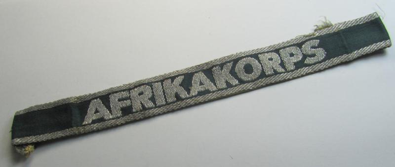 Superb, 'BeVo'-like cuff-title (ie. 'Ärmelstreifen') entitled: 'Afrikakorps' being a with certainty issued and truly worn example that comes in an overall nice- (albeit shortened- and most certainly once tunic-attached-), condition