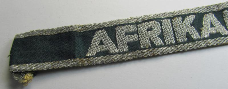 Superb, 'BeVo'-like cuff-title (ie. 'Ärmelstreifen') entitled: 'Afrikakorps' being a with certainty issued and truly worn example that comes in an overall nice- (albeit shortened- and most certainly once tunic-attached-), condition
