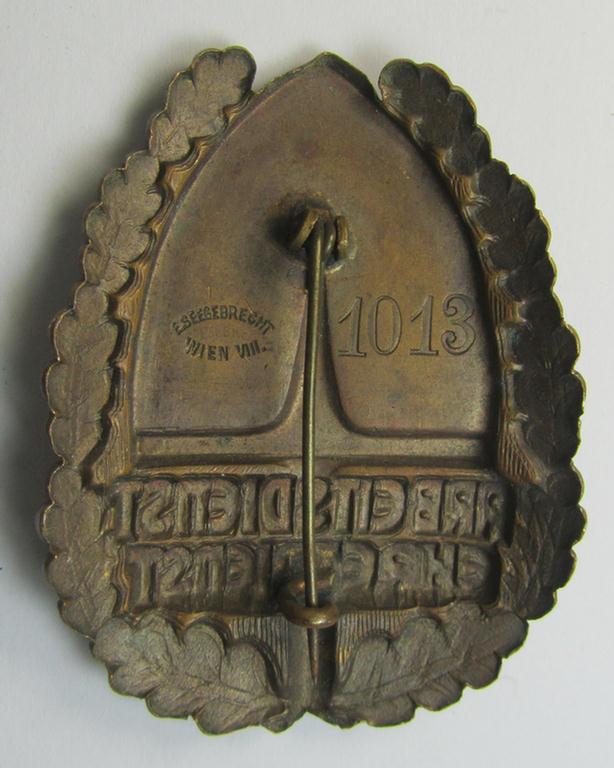 Superb - and Austrian-produced! - example of an: 'Arbeitsdienst Ehrendienst'-honorary-lapel-pin being a bronze-toned- and maker- (ie. 'E. Seegebrecht'-) marked badge that bears a unique, low bearers'-numeral (that reads: '1013')