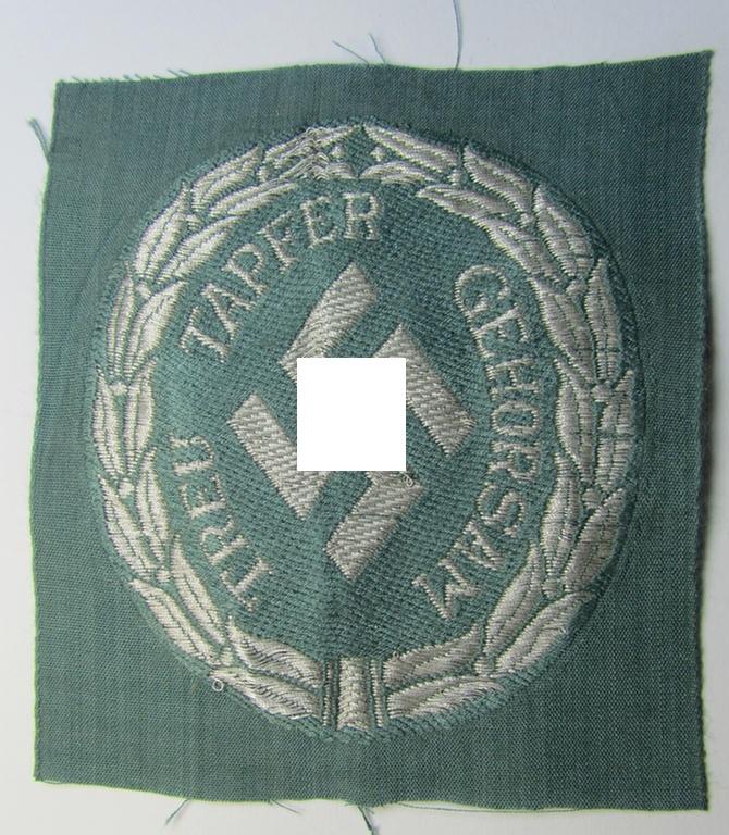 Superb - and actually rarely encountered! - officers'- (ie. evt. NCO-) type, so-called: 'Schutzmannschaften'- (ie. 'Schuma'-) armshield being executed in silver-grey-coloured 'flatwire'-thread onto a police-green-coloured background