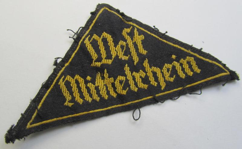 Attractive - albeit clearly used ie. worn - 'HJ' ('Hitlerjugend') district-triangle (ie. 'Gebietsdreieck') being an example that misses its 'RzM-etiket' and that is entitled: 'West Mittelrhein'