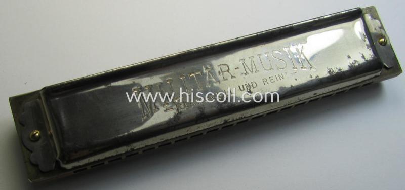Attractive - and with certainty not that easily encountered! - TR-era- (ie. 'Deutsche Wehrmacht'-) related harmonica entitled: 'Militär-Musik - Klangvoll und Rein' and that comes in a moderately used condition