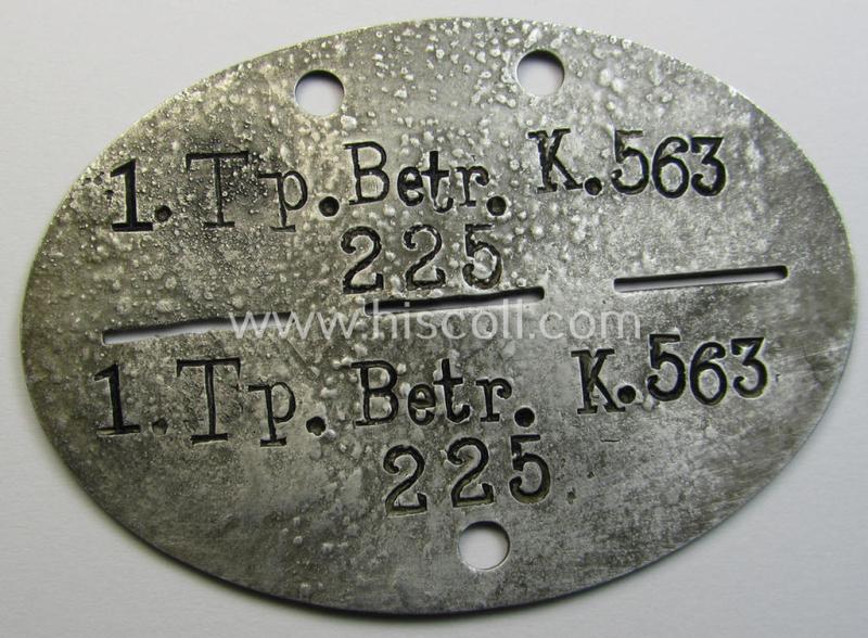 Interesting - and typical aluminium-based - WH (Heeres) ie. 'Truppen-Betreuungs'-related ID-disc (ie. 'Erkennungsmarke') bearing the stamped unit-designation that simply reads: '1.Tp.Betr.K.563'