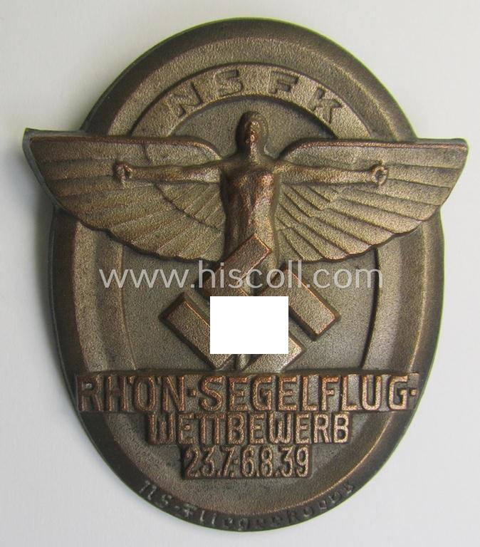 Reddish-bronze-toned, N.S.F.K.-related day-badge (ie. 'tinnie') being a maker- (ie. 'G. Brehmer'-) marked example as was issued to commemorate a specific meeting ie. national rally entitled: 'N.S.F.K. Rhön-Segelflug Wettbewerb 23.7.-6.8.39'