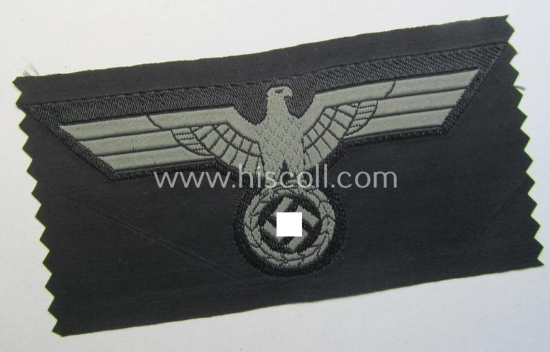 Later- (ie. mid-war-) period, WH (Heeres) 'Panzer'-type breast-eagle (ie. 'Brustadler für Panzertruppen') being a 'virtually mint- ie. unissued' example as executed in bluish-grey-coloured linnen on a black-coloured background