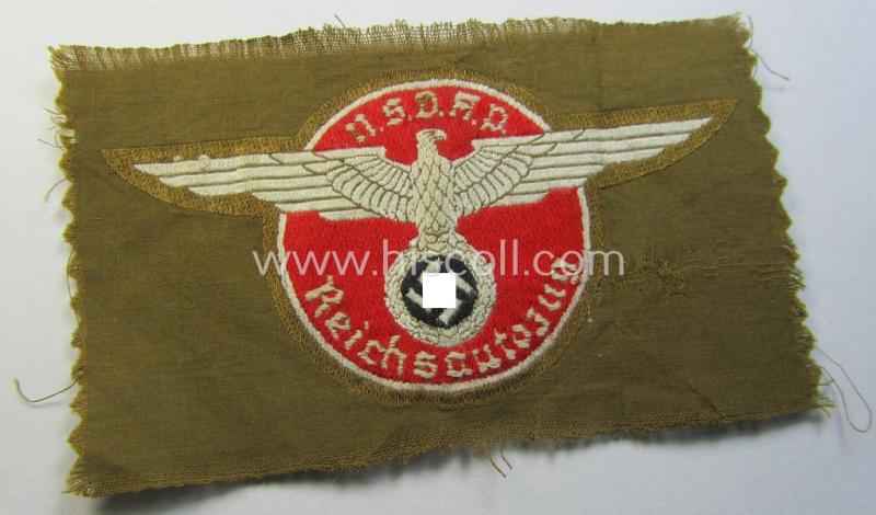 Superb - and rarely encountered! - breast-badge as executed in 'BeVo-weave' pattern as was intended for members within the 'N.S.D.A.P. Reichsautozug' (or: 'RaZ') still retaining its period, paper-based 'RzM'-etiket