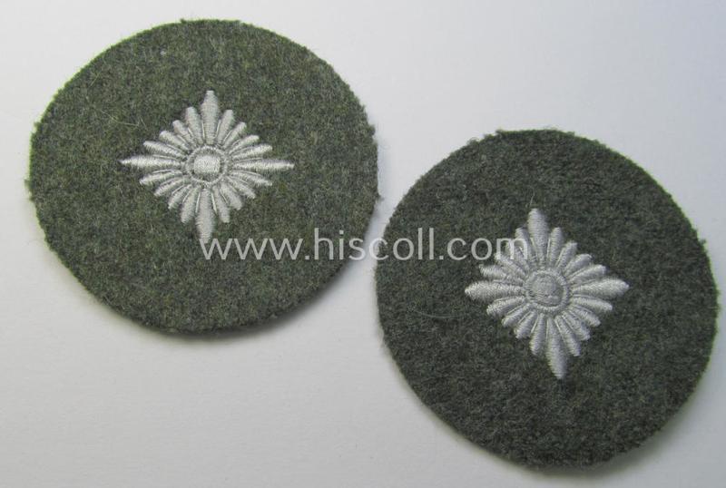 WH (Heeres) rank-insignia (ie. silver-grey-coloured and machine-embroidered 'roundel') as intended to identify a soldier with the rank of: 'Oberschütze', 'Oberjäger' etc. that comes in a 'virtually mint- ie. unissued', condition