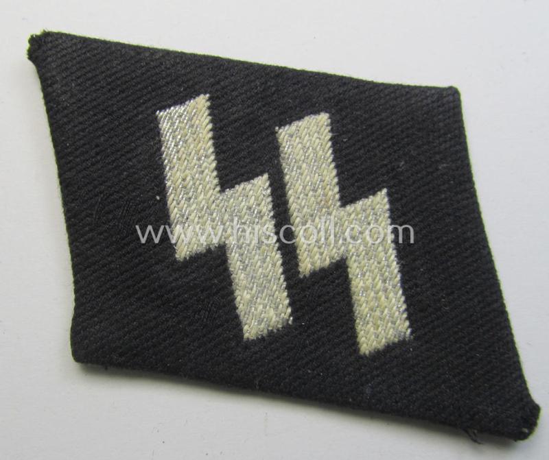 Superb - rarely encountered and neatly 'flat-wire'-woven! - 'Waffen-SS' officers'- (ie. evt. NCO-) pattern 'runes'-collar-tab (ie. 'Kragenspiegel für Führer der Waffen-SS') that comes in a moderately used- and/or worn, condition