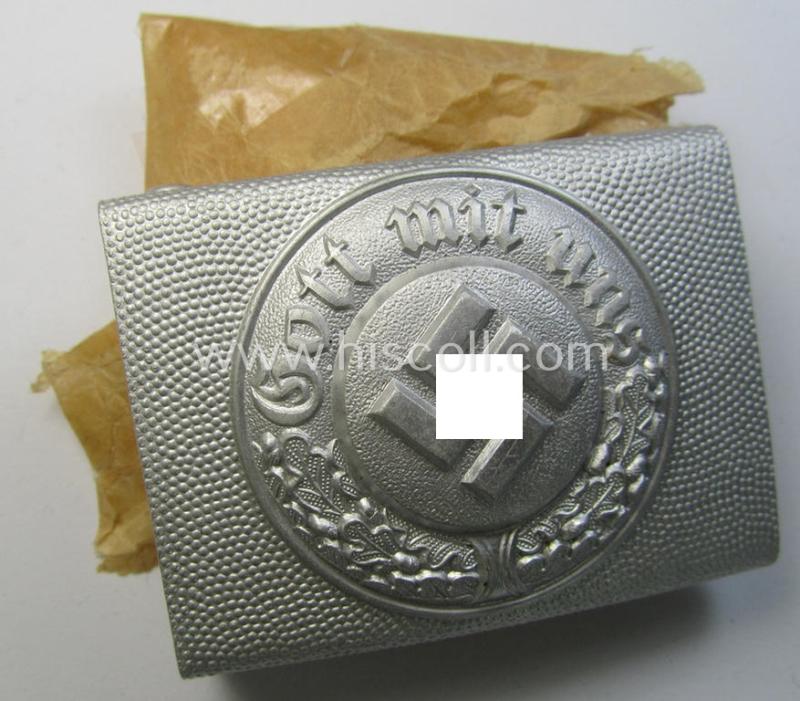 Stunning, Polizei (ie. police) silver-coloured- and/or aluminium-based EM/NCO-pattern belt-buckle being a neatly marker- (ie. 'G.G.L.'-) marked- and 'stonemint' example that came stored in its thin-shaped 'wrapping-paper'