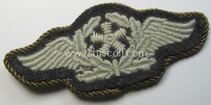 Attractive - and scarcely seen! - example of a WH (Luftwaffe) machine-embroidered, so-called: trade- ie. special-career-patch (ie. 'Tätigkeitsabzeichen') having a golden-yellow-coloured 'Goldkordel' attached as was intended for: 'Flugzeugpersonal'