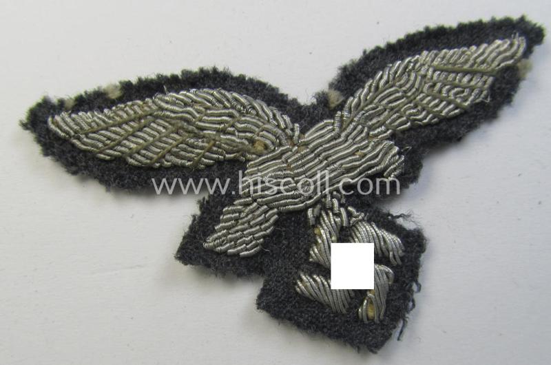 Attractive - truly used and quite detailed! - WH (Luftwaffe) officers'-pattern, visor-cap eagle (ie. 'Adler für Schirmmütze') being a neatly hand-embroidered example that comes on a typical greyish-blue-coloured- and/or woolen-based background