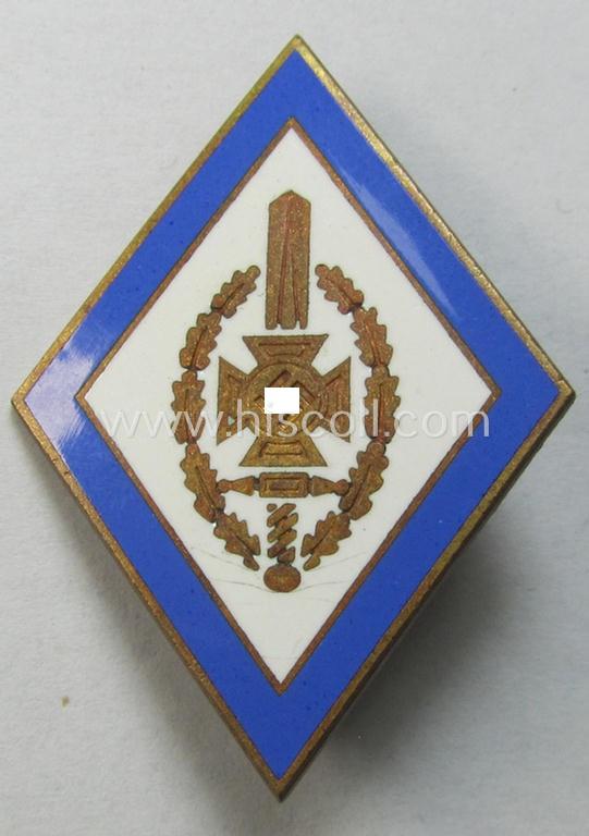 Attractive - blue-rimmed- and neatly enamelled! - honorary membership-lapel-pin (ie. 'Ehrenzeichen') as was intended for service within the: 'Nat. Soc. Kriegsopferversorsung' (ie. 'N.S.K.O.V.') being a maker- (ie. 'S&L'-) marked example