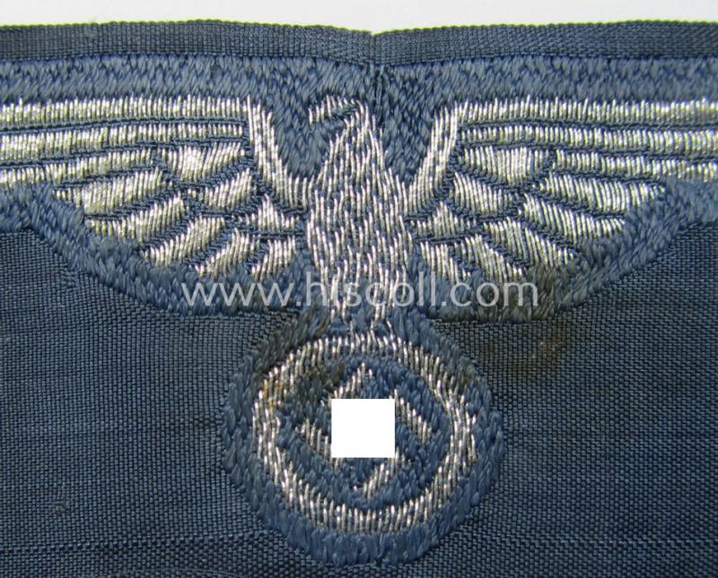 Superb, BZP (ie. 'Bahnschutz-Polizei') officers'-/ie. NCO-type side-cap- (ie. 'Schiffchen'-) eagle as woven in 'flat-wire-BeVo'-style and executed in bright-silver thread on a greyish-blue-coloured and linnen-based background
