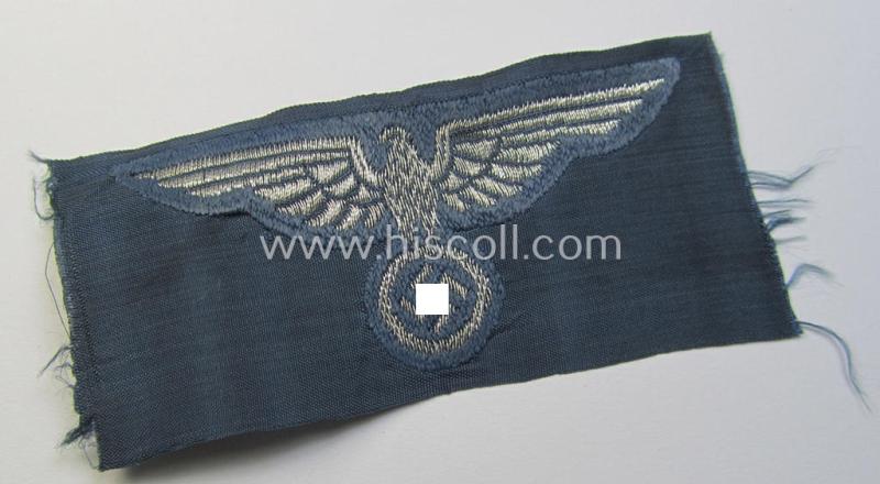 Superb, BZP (ie. 'Bahnschutz-Polizei') officers'-/ie. NCO-type side-cap- (ie. 'Schiffchen'-) eagle as woven in 'flat-wire-BeVo'-style and executed in bright-silver thread on a greyish-blue-coloured and linnen-based background