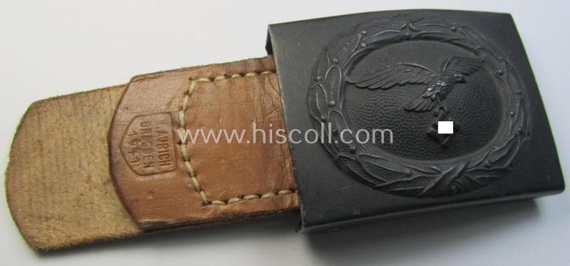 WH (Luftwaffe) bluish-grey-coloured, steel-based belt-buckle, being a maker- (ie. 'H. Aurich'-) marked- and/or: '1941'-dated example that comes mounted onto its leather-based tab and that comes in a 'virtually mint- ie. unissued'-, condition