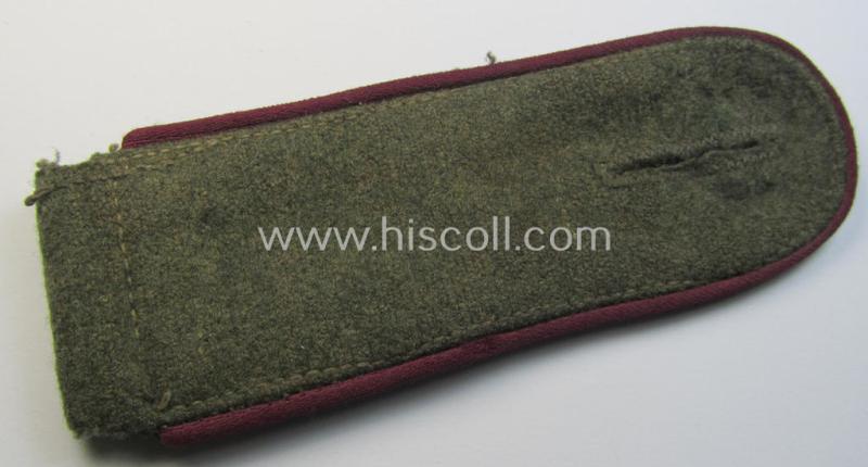 Single - but neverthless scarcely seen! - WH (Heeres) EM-type (ie. 'M43'-pattern) shoulderstrap as piped in the darker-purple-red- (ie. 'bordeaux-roter'-) coloured branchcolour as was intended for usage by a: 'Soldat der Nebelwerfer-Truppen'