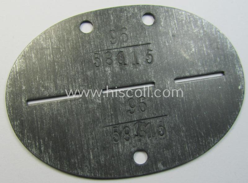 Zinc-based, WH (LW) ie. 'Flieger'-related ID-disc, bearing the clearly stamped- and/or: 'coded'-unit- ie. 'MOB'-designation that reads: '58115' (and as such belonging to a soldier who served within the: '2./Erg.Jagdgruppe Süd')