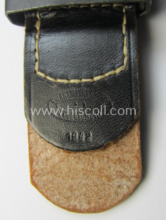 WH (Luftwaffe) bluish-coloured, steel-based belt-buckle being a maker- (ie. 'F.W. Assmann & Söhne'-) marked- and/or: '1942'-dated example that comes mounted onto its leather-based tab and that comes in a 'virtually mint- ie. unissued'-, condition