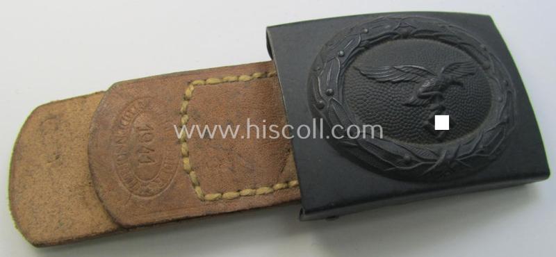 WH (Luftwaffe) bluish-grey-coloured, steel-based belt-buckle, being a maker- (ie. 'E. Schneider'-) marked- and/or: '1941'-dated example that comes mounted onto its leather-based tab and that comes in a 'virtually mint- ie. unissued'-, condition