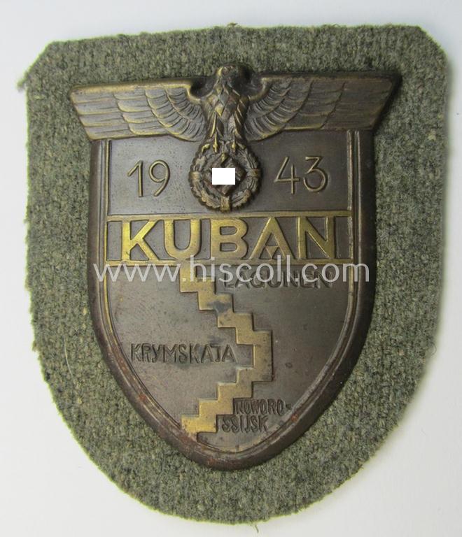 Very attractive - and actually scarcely encountered! - WH (Heeres ie. Waffen-SS) 'Kuban'-campaign-shield that comes mounted onto its original field-grey-coloured- and/or woolen-based 'backing'