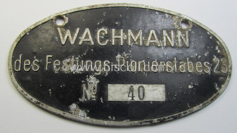 Very interesting, black-coloured and aluminium-based ID-plaque ('Schild') entitled: 'Wachmann des Festungs-Pionierstabes 23' (bearing a serial-numeral and engraved name: 'Gef. Richard Kastner')