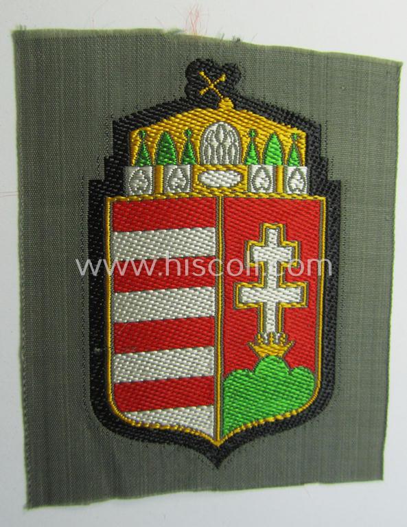 Attractive - and scarcely encountered! - German-produced, 'BeVo'-type armshield showing the coat of arms of Hungary (being a piece that was intended for a volunteer who served within the: 'Deutsche Wehrmacht')