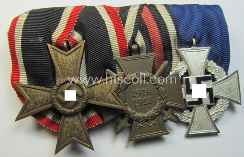 Three-pieced medal-bar (ie. 'Ordenspange') respectively depicting a: 'KvK II.Klasse o. Schw.', a: WWI-period: 'Frontkämpferkreuz 1914-18' (ie.: 'Kriegsteilnehmerkreuz mit Schwertern') and a: 'Treuedienst Ehrenzeichen 2. Klasse'
