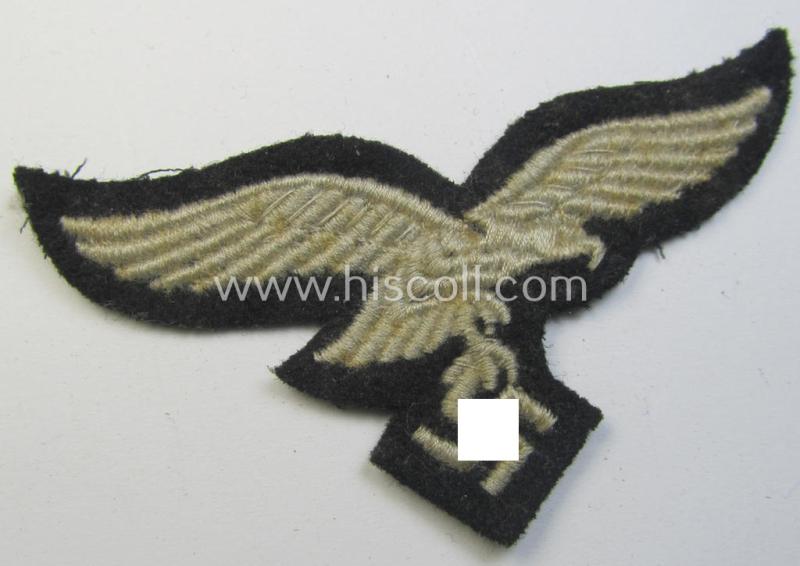 Attractive, WH (Luftwaffe) cap-eagle (being a 'standard-issue'-pattern example that is executed on a black-coloured background and that was as such intended for usage on the black-coloured work- ie. 'HG'-related side-caps ie. 'Schiffchen')