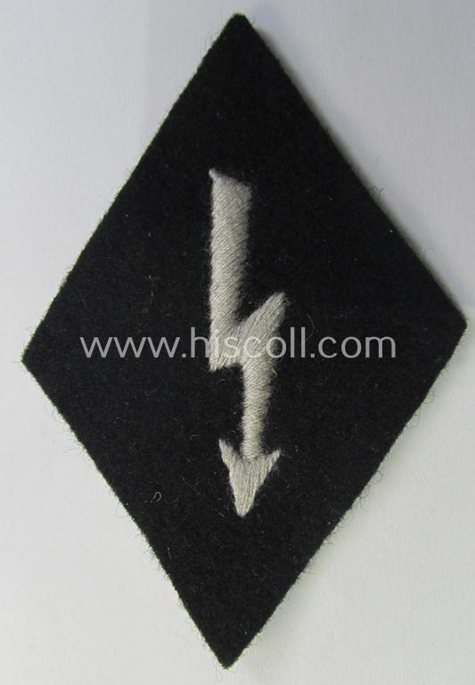 Waffen-SS-pattern, machine-embroidered and black-coloured sleeve-insignia (ie. 'Ärmelraute') depicting a so-called: 'Signalblitz' as was used and intended to signify membership within a: 'Waffen-SS Nachrichten'-unit