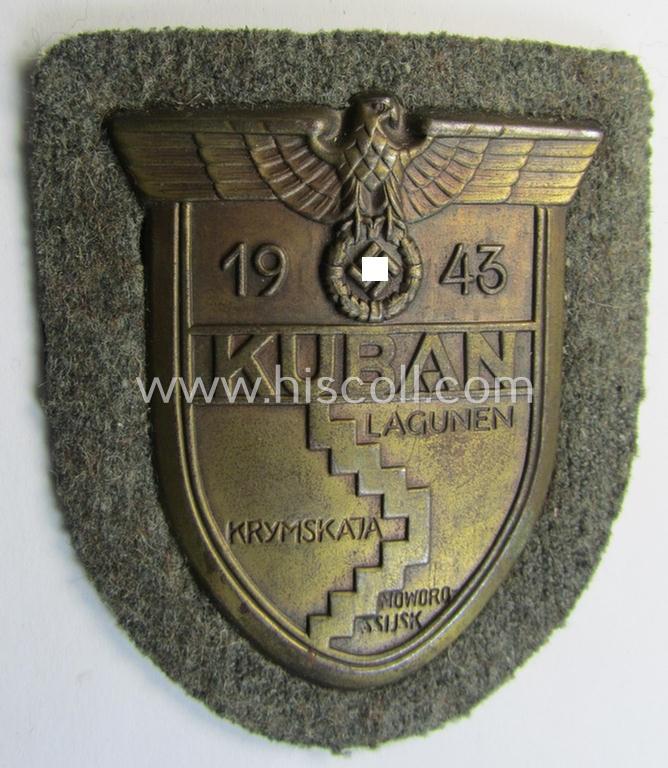 Very attractive - and actually scarcely encountered! - WH (Heeres ie. Waffen-SS) 'Kuban'-campaign-shield that comes mounted onto its original field-grey-coloured- and/or woolen-based 'backing'