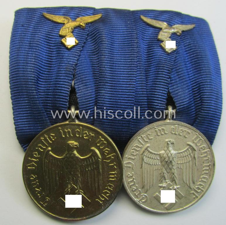 Superb, two-pieced medal-bar (ie. 'Spange') showing two: WH (Luftwaffe) so-called: 'Dienstauszeichnungen für 4 u. 12 Jahre Treue Dienste' that both come period-mounted as a so-called: 'Doppelspange'