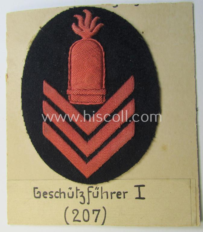 Unusual example of a neatly hand-embroidered WH (Kriegsmarine) trade- ie. special-career-patch (ie. 'Tätigkeitsabzeichen') as was intended for a: 'Geschützführer I' (and that comes as period-attached on a carton 'card')