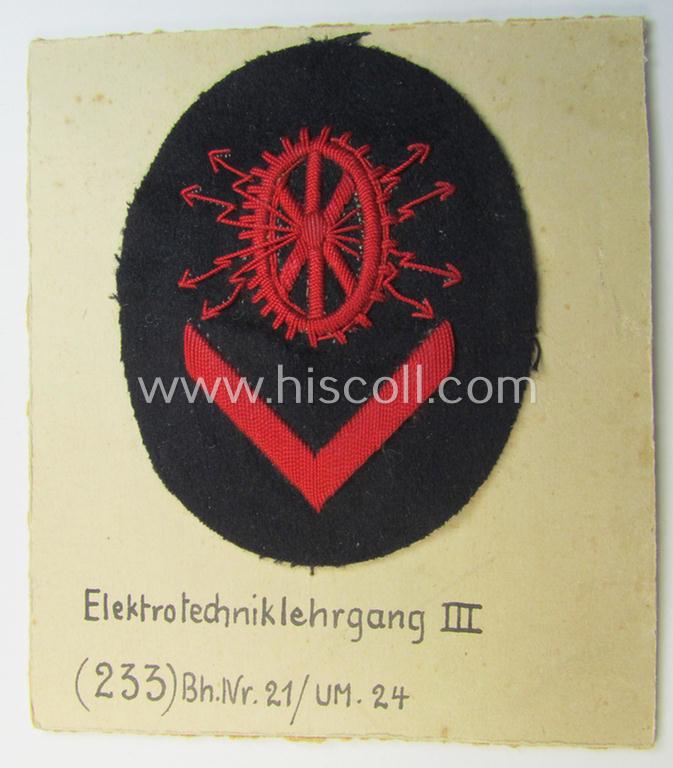 Unusual example of a neatly hand-embroidered WH (Kriegsmarine) trade- ie. special-career-patch (ie. 'Tätigkeitsabzeichen') as was intended for a: 'Elektrotechniklehrgang III' (and that comes as period-attached on a carton 'card')