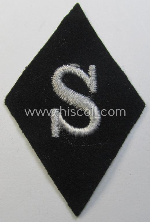 Rarely found Waffen-SS-pattern, machine-embroidered and black-coloured sleeve-insignia (ie. 'Ärmelraute') depicting a captital: 'S'-character as was used to signify the function of: 'Schirrmeister' within the: 'Waffen-SS'