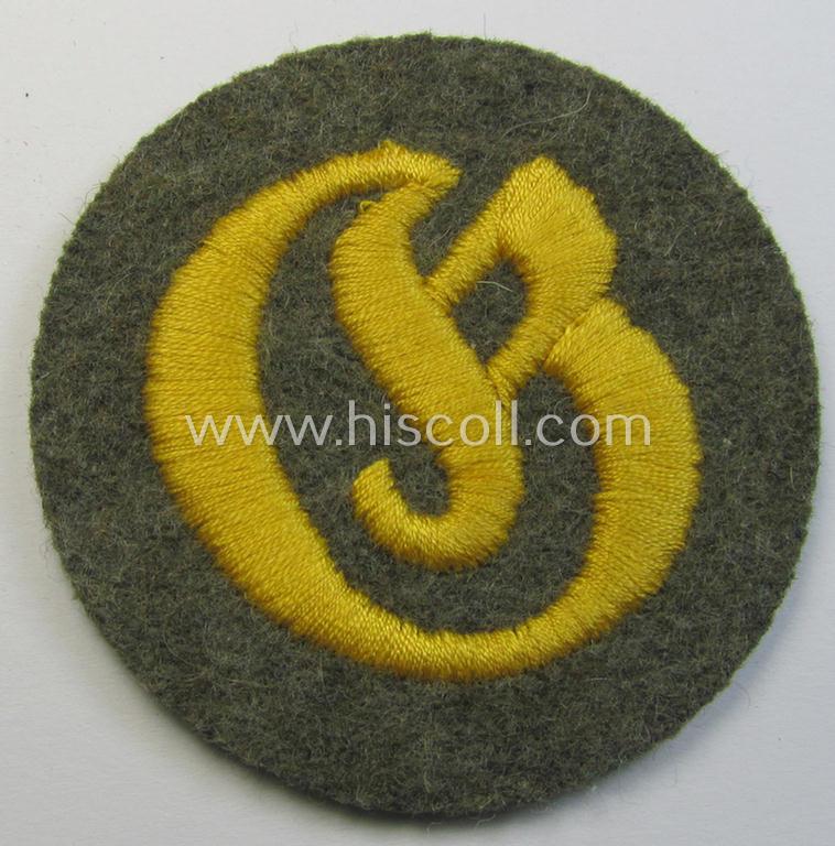 Neat - later-war-period- and actually quite scarcely encountered! - WH (Heeres) machine-embroidered, trade- or special-career insignia (ie. 'Laufbahn- o. Tätigkeitsabzeichen') as was intended for a: 'Geräteverwaltungs-Unteroffizier'