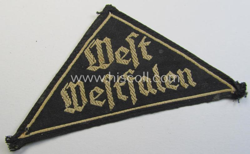 'HJ' ('Hitlerjugend') ie. 'BDM' ('Bund Deutscher Mädel'-) district-triangle (ie. 'Gebietsdreieck') entitled: 'West Westfalen' being a moderately used- ie. worn example that misses (some of) its paper-based 'RzM'-etiket