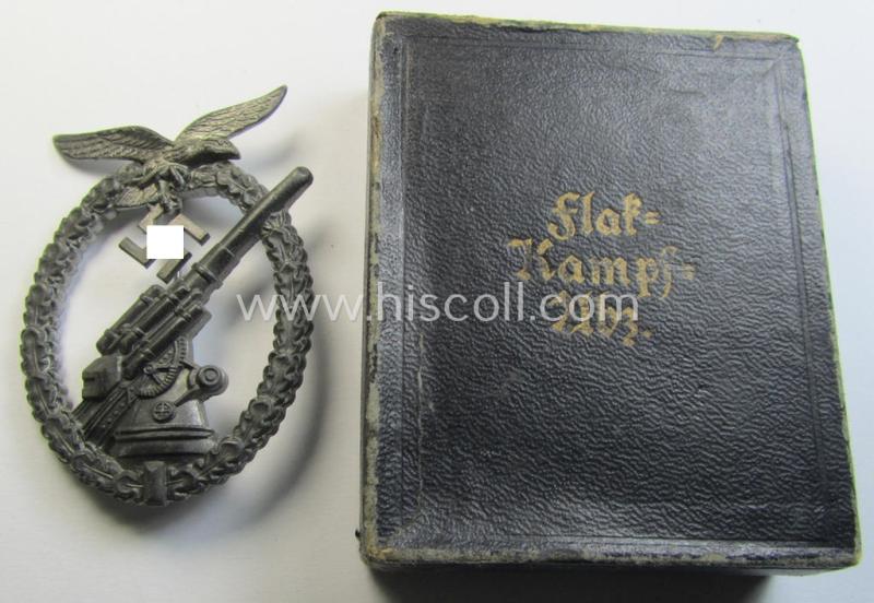 Attractive - and actually not that often seen! - later-war-period, 'Feinzink'-based example of a WH (Luftwaffe) 'Flakkampfabzeichen' (as was produced by a to date unknown maker and that comes stored in its typical etui)