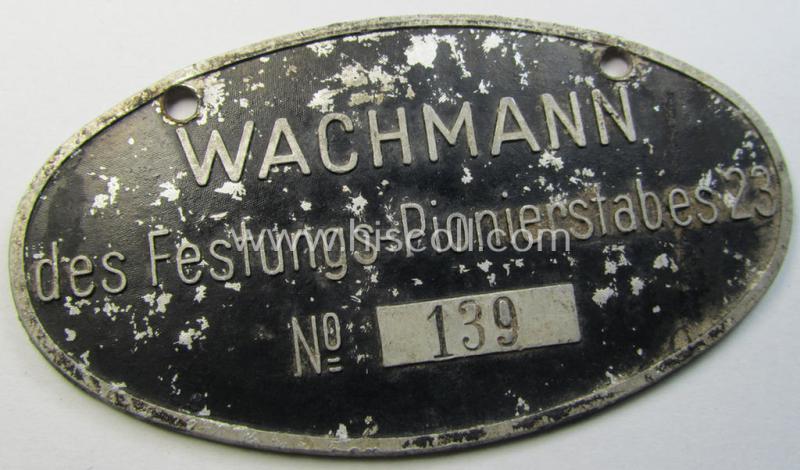 Very interesting, black-coloured and aluminium-based ID-plaque ('Schild') entitled: 'Wachmann des Festungs-Pionierstabes 23' (bearing a serial-numeral and period-engraved name: 'O.Gef. Ludwig Deppich')