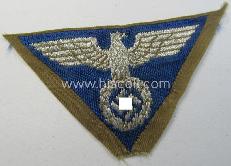 Attractive, SA-related cap-eagle as was intended for the: 'Lagermütze' (ie. side-cap) being an example as woven on a bright-blue-coloured background and as such intended for members within the: 'SA-Gruppe Warthe o. Oberrhein'